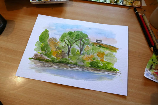 This is an original watercolour painting of Penshaw Monument viewed from WWT Washington Wetlands, created in a contemporary urban sketching style. Strong ink lines and loose washes capture the iconic monument on the hilltop, framed by trees and reflected across the River Wear.
